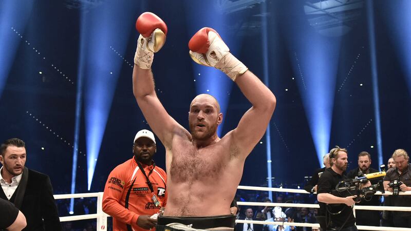 Britain's Tyson&nbsp;Fury&nbsp;celebrates after winning Saturday's world heavyweight title fight for Ukraine's Wladimir Klitschko's WBA, IBF, WBO and IBO belts in the Esprit Arena in Duesseldorf