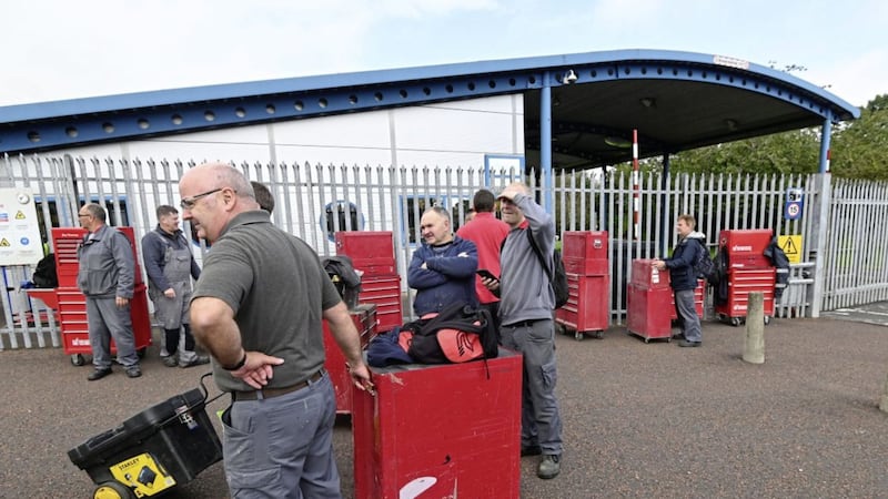Workers outside the Wrightbus plant in Ballymena on the day news broke that the company was going into administration 