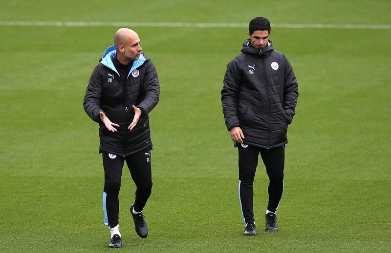 Arsenal boss Mikel Arteta, right, used to be an assistant of Pep Guardiola at Manchester City (Barrington Coombs/PA)