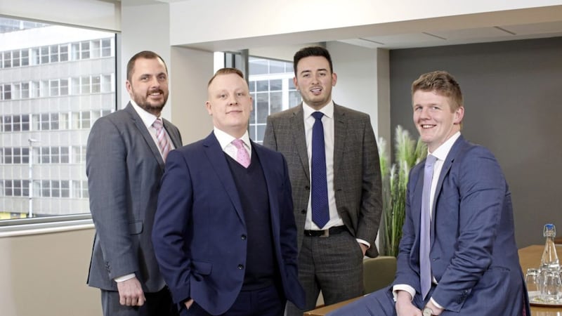 Onecom head of sales for Northern Ireland Paul Lawther (second from left) with business development managers Mark Fraser, Darren Brown and Stuart Lunn 