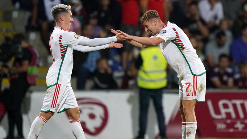 David Brooks (right) celebrates scoring Wales’ second goal with Harry Wilson against Latvia in Riga (Tim Goode/PA)