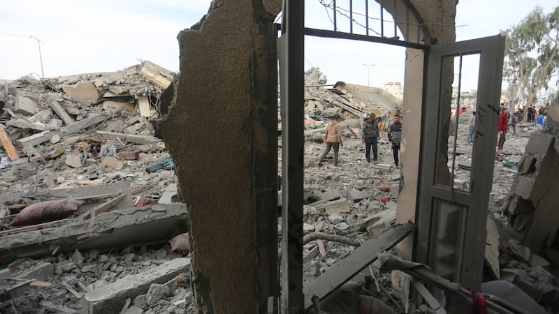 Palestinians look at destruction by the Israeli bombardment of the Gaza Strip in Rafah (Hatem Ali/AP)