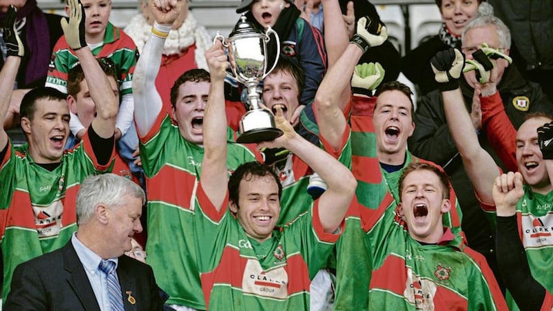 Lisnaskea Emmetts Captain Brian Og Maguire lifts the trophy in triumph after winning the AIB Ulster Intermediate Football Club Championship Final at Breffni Park Cavan. Photograph by Philip Fitzpatrick 