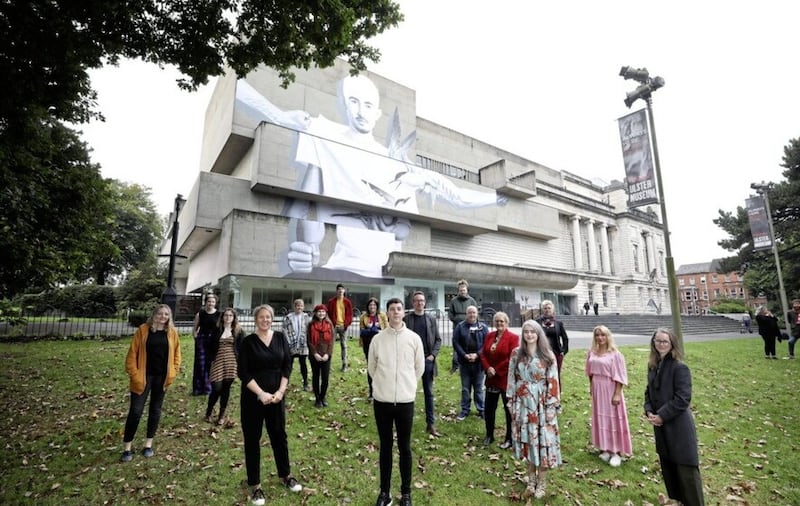 Joe Caslin (centre) pictured under his 2021 'Counterpart' art installation at Belfast's Ulster Museum. Picture: Kelvin Boyes/Press Eye