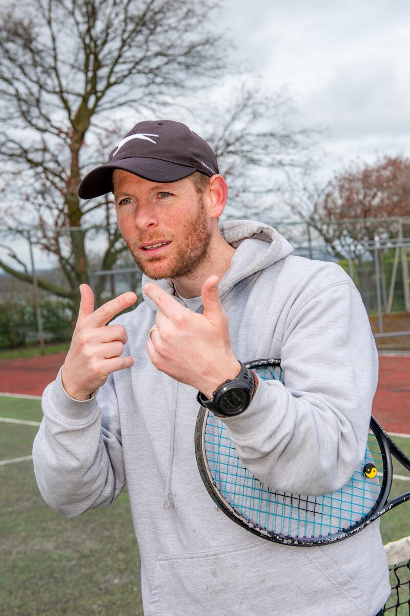 Belfast man Anthony Sinclair using sign language on a tennis court
