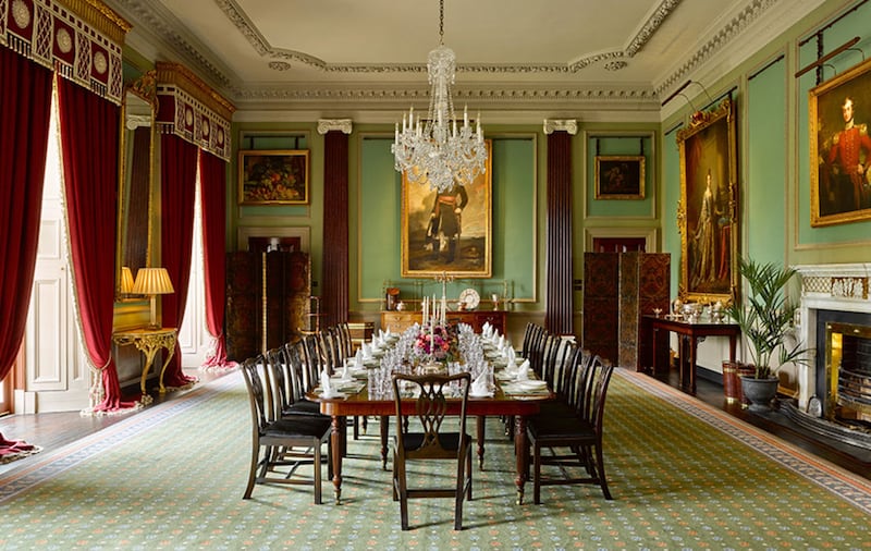 The State Dining Room at Hillsborough Castle. A Waterford Crystal Chandelier hangs above the long mahogany dining table. Picture by Historic Royal Palaces