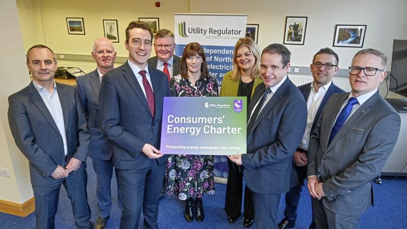 Peter McClenaghan and John French (centre) with representatives from the north's main energy suppliers. 