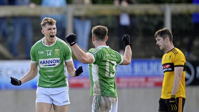 Ruairi McCann celebrates with Gareth Magee after beating St Enda&#39;s to reach the quarter-finals Picture Mark Marlow 