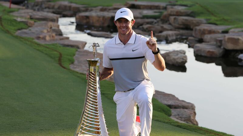 Rory&nbsp;McIlroy&nbsp;poses with the Race to Dubai trophy after he won the final round of the DP World Tour Championship golf tournament on Sunday