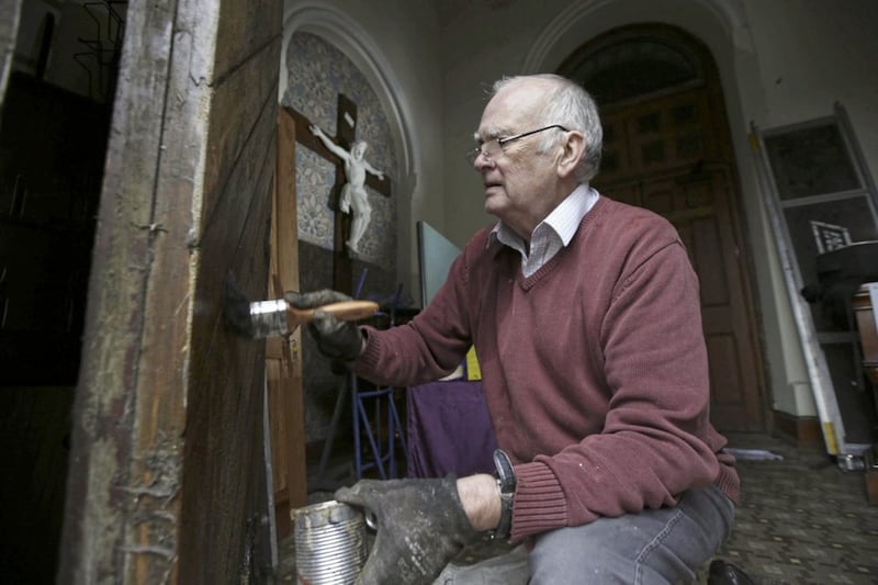 French polisher and antiques restorer Tony Smyth works on the 143-year-old vestment cabinet in St Patrick&#39;s Church in Belfast. Picture by Hugh Russell 