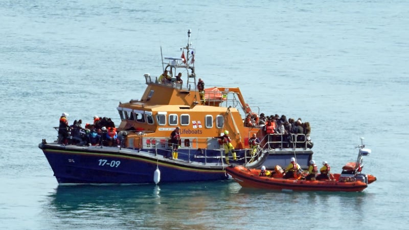 A group of people thought to be migrants are brought in to Dover, Kent, onboard the RNLI Dover Lifeboat following a small boat incident in the Channel