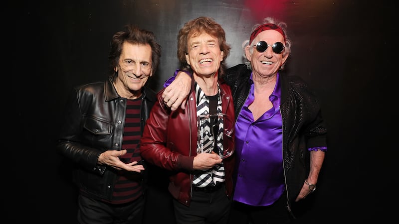 Ronnie Wood, Mick Jagger and Keith Richards with their Brit Billion award (Polydor/PA)