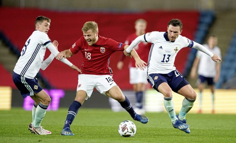 Norway&#39;s Fredrik Midtsjo battles for the ball with Northern Ireland&#39;s Corry Evans (right) and Gavin Whyte. Picture by PA 