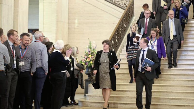 Arlene Foster, centre,with DUP MLA&#39;s are applauded by supporters while they descend the steps of Stormont Parliament buildings in Belfast following a plenary session on Monday October 21 PICTURE: Niall Carson/PA 