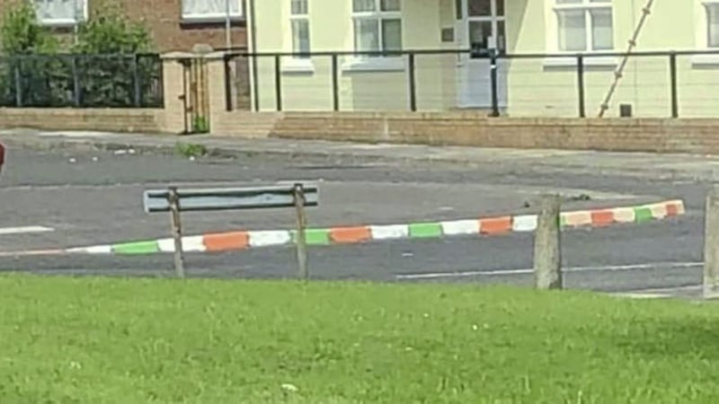The kerbstones in Limavady painted green, white and orange. Pictures from BBC 