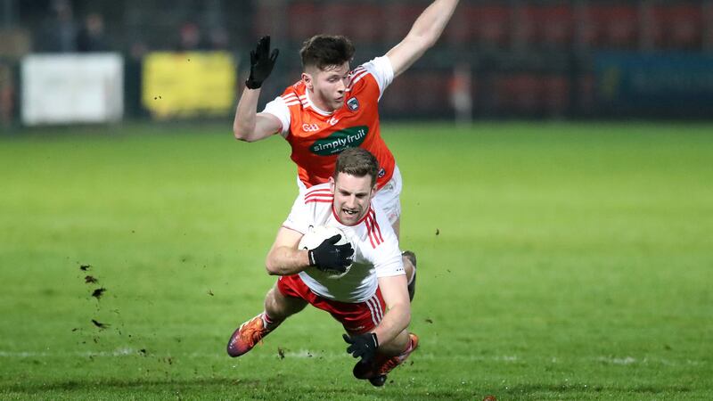 Armagh's Joe McElroy tackles Niall Sudden of Tyrone during last night's Dr Mc Kenna Cup Section C game at the Athletic Grounds<br/>Picture by Declan Roughan