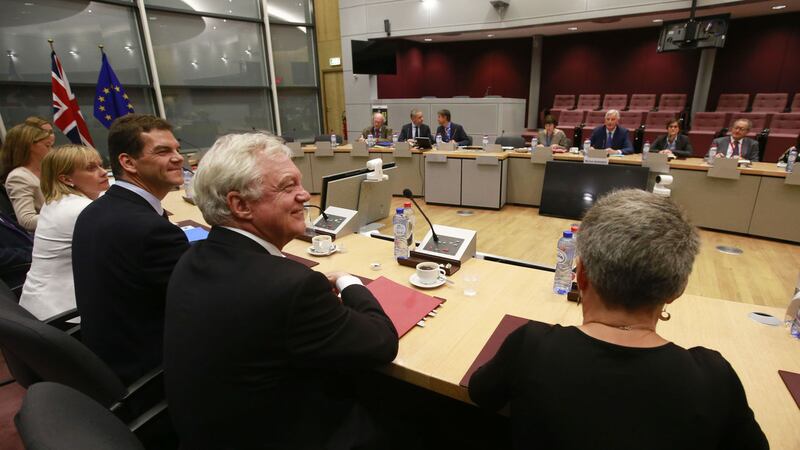 Britain's Secretary of State for Exiting the European Union, David Davis, centre left, sits with his team during a meeting with European Union Chief Brexit negotiator, Michel Barnier, centre right, and his team during the third round of negotiations on Brexit talks at EU headquarters in Brussels on Thursday, Aug. 31, 2017. (Olivier Hoslet, Pool Photo via AP)&nbsp;