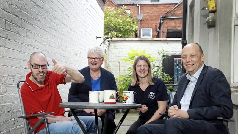 Thomas (left) is pictured with his Patricia Higgins, CEO Social Care Council, Rachael Mackarel, senior support worker at L&#39;Arche, and Peter May, permanent secretary for the Department of Health 