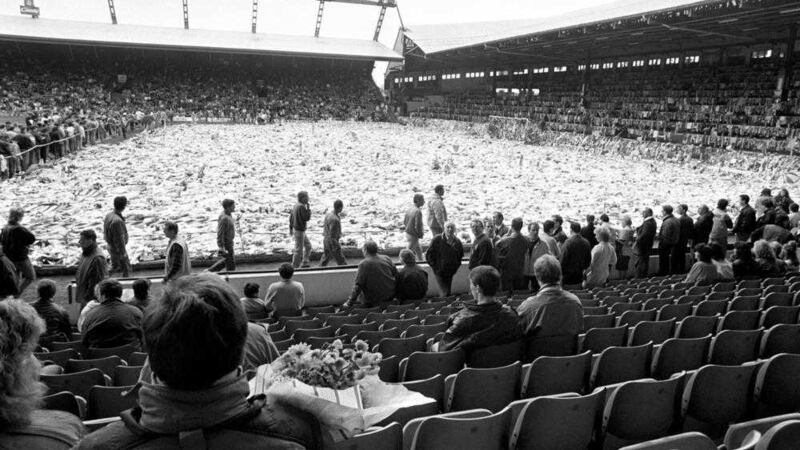 Thousands of fans, friends and family gather around the flower-filled pitch at Anfield Stadium for a rememberance ceremony for those killed in the Hillsborough disaster in April 1989 