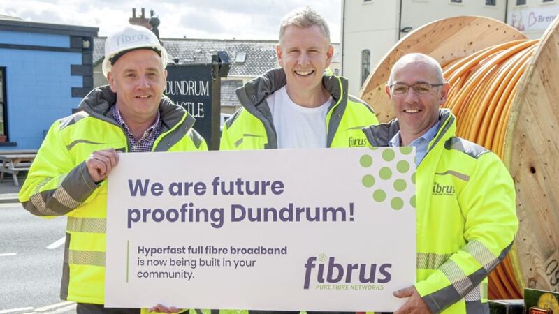 Patrick Kielty is joined at the Fibrus broadband roll out in Dundrum by, left, Craig Adair (network delivery manager) and Conor Harrison (chief operating officer) 