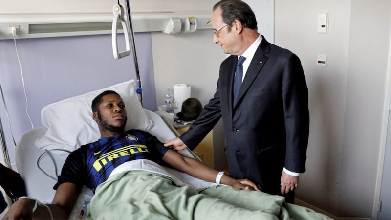 France&#39;s president Francois Hollande stands next to the alleged victim, identified only by his first name, Theo. Picture by Arnaud Journois, Le Parisien via Associated Press. 