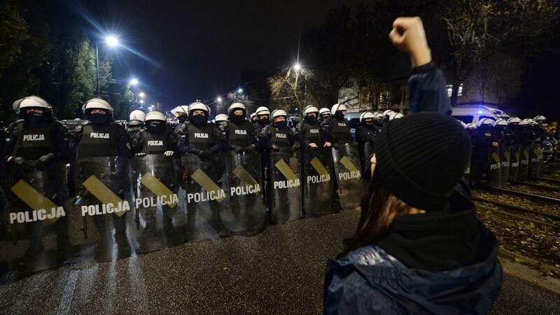Riot police line up as a crowd gathers outside the house of Poland's ruling conservative party leader Jaroslaw Kaczynski in Warsaw, Poland, on October&nbsp;23 2020. Picture by Czarek Sokolowski, AP
