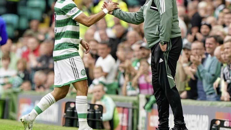 Celtic&#39;s Jota shakes hands with manager Ange Postecoglou, who will make a late decision on the fitness of Jota for Tuesday&#39;s Champions League clash with RB Leipzig 
