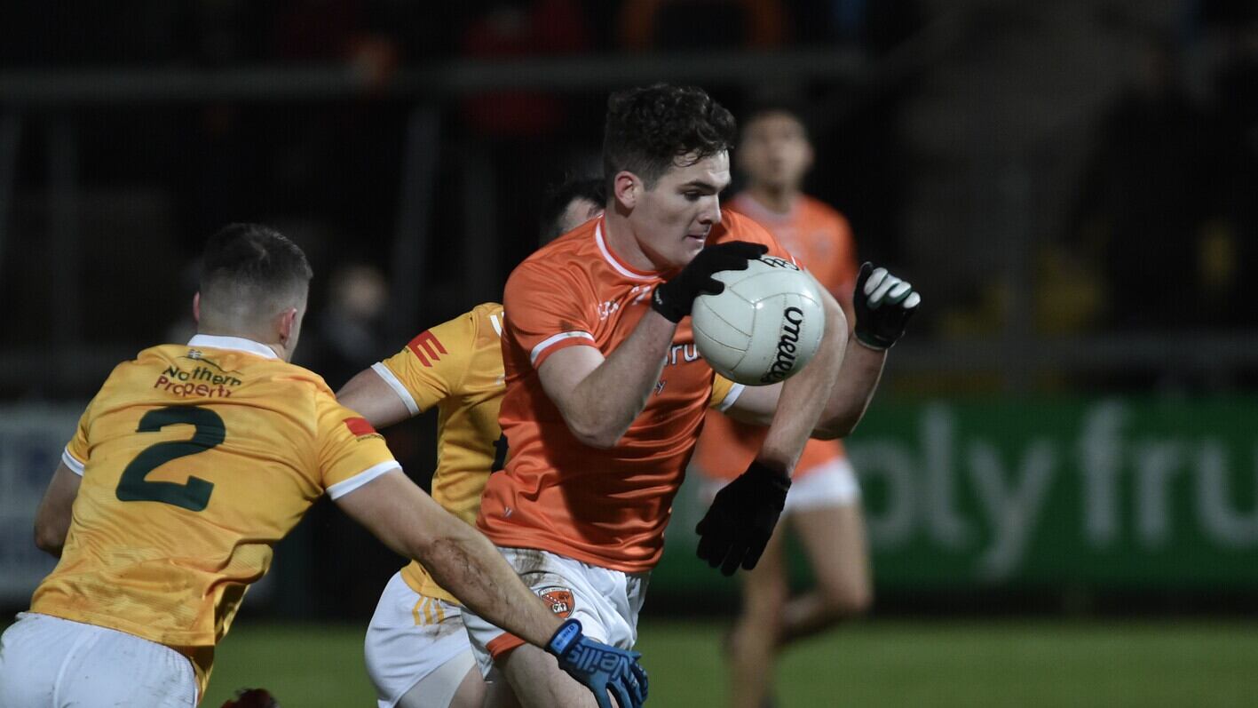 Armagh's Jarlath Burns tries to evade the challenge of Antrim's Paddy McBride during Wednesday night's Dr McKenna Cup Section C match at the Athletic Grounds     Picture: John Merry