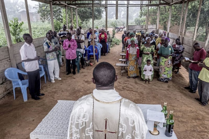 Abb&eacute; Michel Kabongenaje celebrates Mass in the Ebola-hit town of Mambasa, Democratic Republic of the Congo. The Abb&eacute; frquently preaches about the dangers of Ebola to his congregation. Picture by CAFOD 