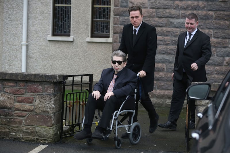 A wheel-chair bound Shane MacGowan is helped from the church as the funeral of his mother Therese MacGowan takes place  &nbsp;