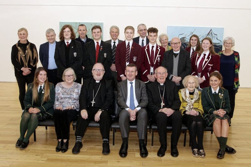 Francis Campbell, pictured at the centre of the front row, with school pupils, clergy and other guests at an Armagh Cathedrals&#39; Partnership event 