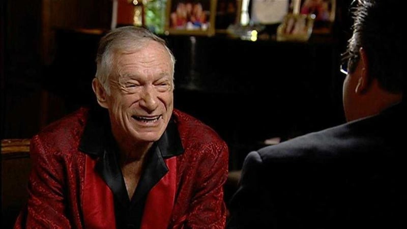 Hugh Hefner in his trademark silk pyjamas and robe could be yours for the princely sum of $200 million. The Playboy Mansion is being thrown in to sweeten the deal 
