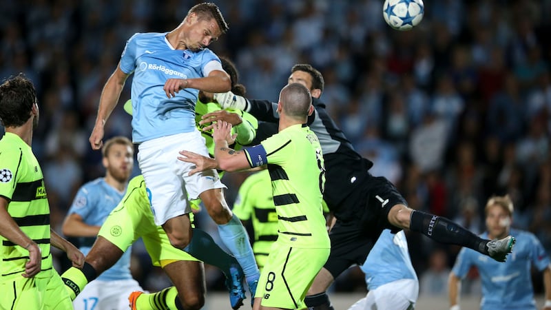 Malmo's Markus Rosenberg heads home the opening goal past Celtic goalkeeper Craig Gordon during Tuesday night's Champions League qualifier&nbsp;<br />Picture: AP