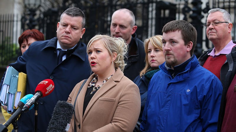 Emma Rogan (centre), whose father was killed in the attack at Loughinisland, pictured outside the High Court in Belfast with other victims' family members. Picture by Mal McCann&nbsp;