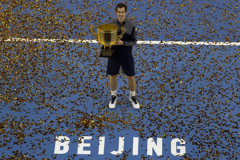 Andy Murray poses with his trophy after defeating Grigor Dimitrov of Bulgaria in the men's singles final match at the China Open tennis tournament in Beijing on Sunday, October 9, 2016