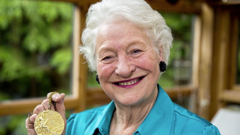 Mary Peters, with her gold medal, at her home in Belfast ahead of her 80th birthday 