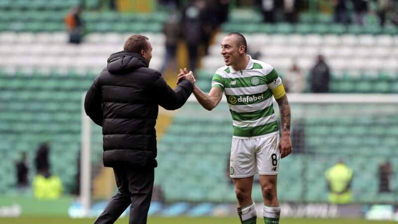 Celtic manager Brendan Rodgers and captain Scott Brown celebrate on the Parkhead pitch after their 6-0 win over Inverness CT in the fifth round of the William Hill Scottish Cup Picture: PA 