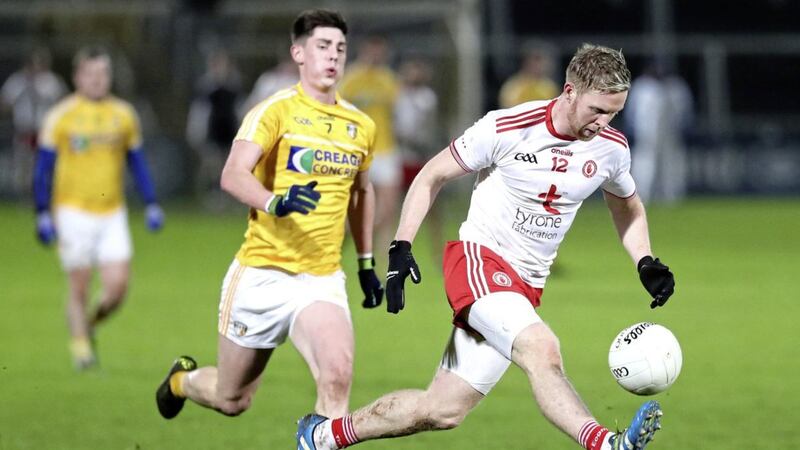 Tyrone&#39;s Frank Burns strides away from Antrim&#39;s Paddy McAleer in this Dr McKenna Cup clash at the Athletic Grounds in Armagh. Picture Declan Roughan.. 