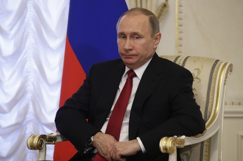 Russian President Vladimir Putin listens during his meeting (Dmitri Lovetsky/AP)