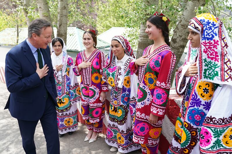 Lord Cameron meets local women at the Nurek Hydro-Electric Project, as he visits Tajikistan during his tour of the Central Asia region