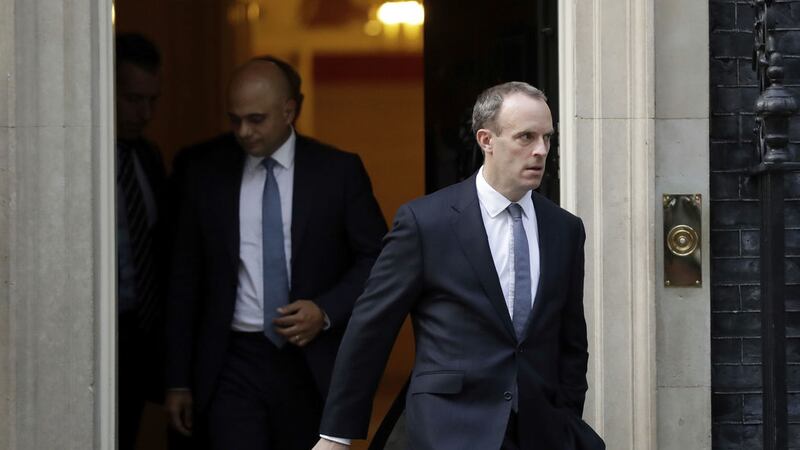 Secretary of State for Exiting the European Union Dominic Raab, right, and home Secretary Sajid Javid, leave 10 Downing Street in London<br />Picture by Matt Dunham/AP