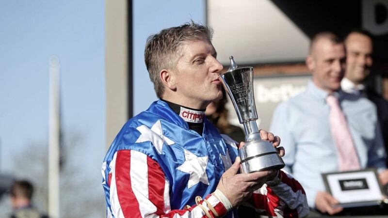 The Irish News&#39; guest columnist Noel Fehily celebrates with the trophy after winning the Betway Queen Mother Champion Chase onboard Special Tiara 