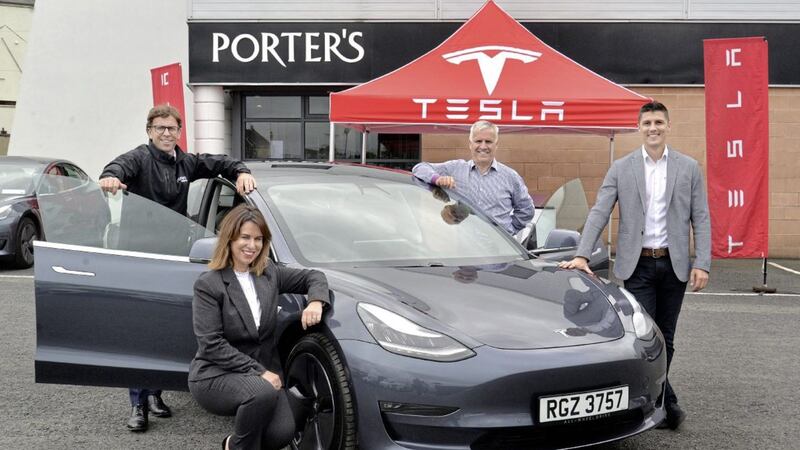 Celebrating the new partnership are (at back) Porters&#39; Bodyshop managing director Colin Porter and chairman Jim Porter, with Jane Clarke, the firm&#39;s finance director, and Anton Marnitz from Tesla 
