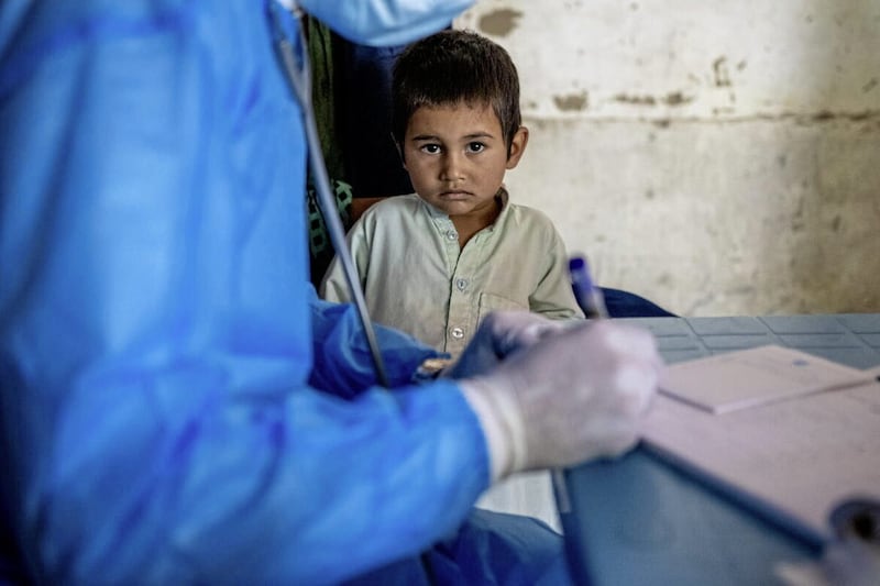 A three-year-old boy receiving treatment for pneumonia at a Save the Children mobile clinic in Afghanistan 
