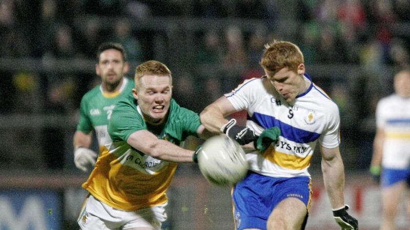 Carrickmore&#39;s Oran McKee trying to stop Errigal Ciaran&#39;s Peter Harte from scoring a point 