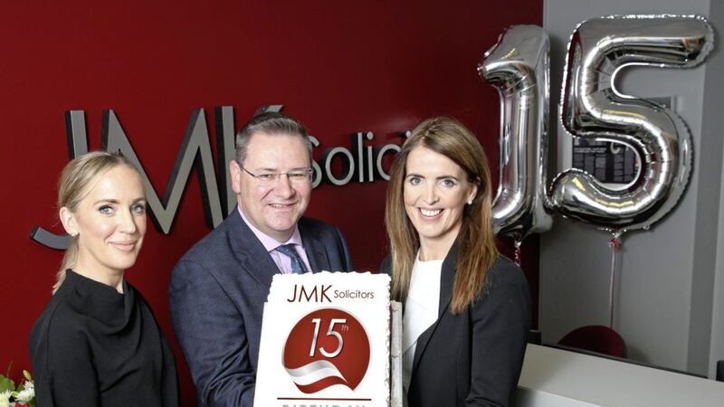 Pictured celebrating the 15th birthday at JMK Solicitors are: Olivia Meehan, legal services director; Jonathan McKeown, chairman and Maurece Hutchinson, managing director. 