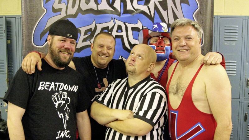 Ex-Labour politician Ed Balls, right, with a group of US wrestlers who feature in Travels in Trumpland with Ed Balls 