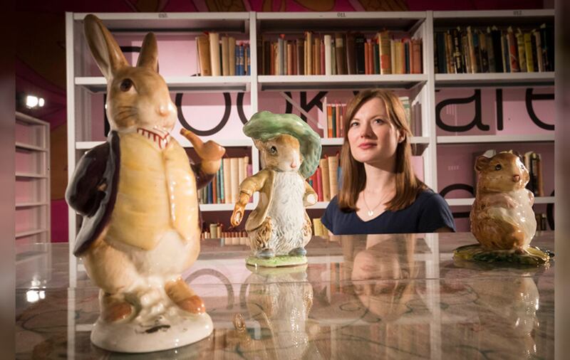 Medical student Helena Sinclair, from Hull, views a display with Beatrix Potter figurines at Larkin: New Eyes Each Year exhibition. Picture by Danny Lawson, PA Wire&nbsp;