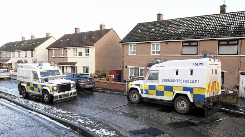 Police outside the house in west Belfast where married couple Peter and Marie Dorrian were shot and injured on Thursday night 