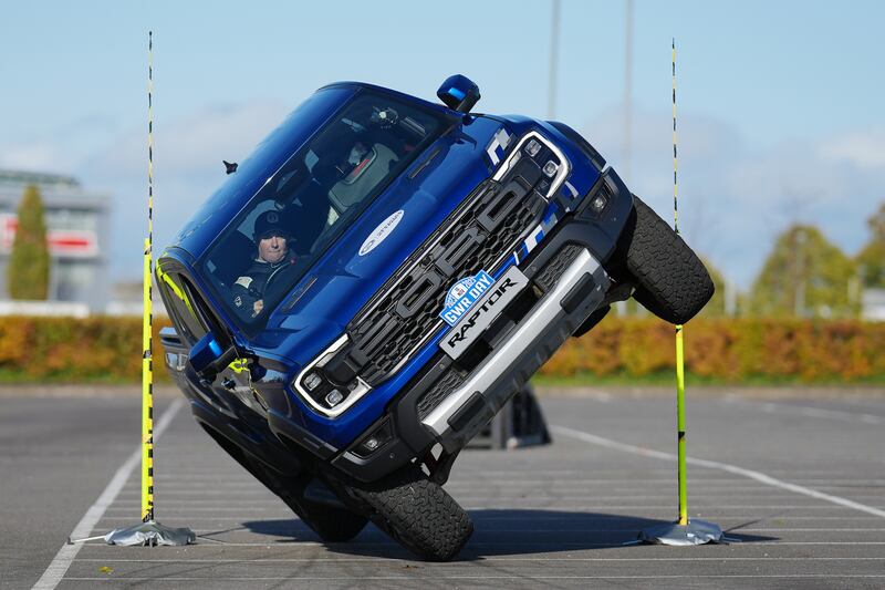 Paul Swift achieves the Guinness World Record for ‘The tightest gap driven through on two wheels in a pick up truck (88cm)’ in celebration of Guinness World Records Day 2023 (GUINNESS WORLD RECORDS DAY 2023)